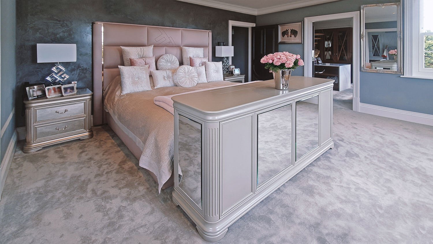Pop-up TV lift closed at the foot of the bed