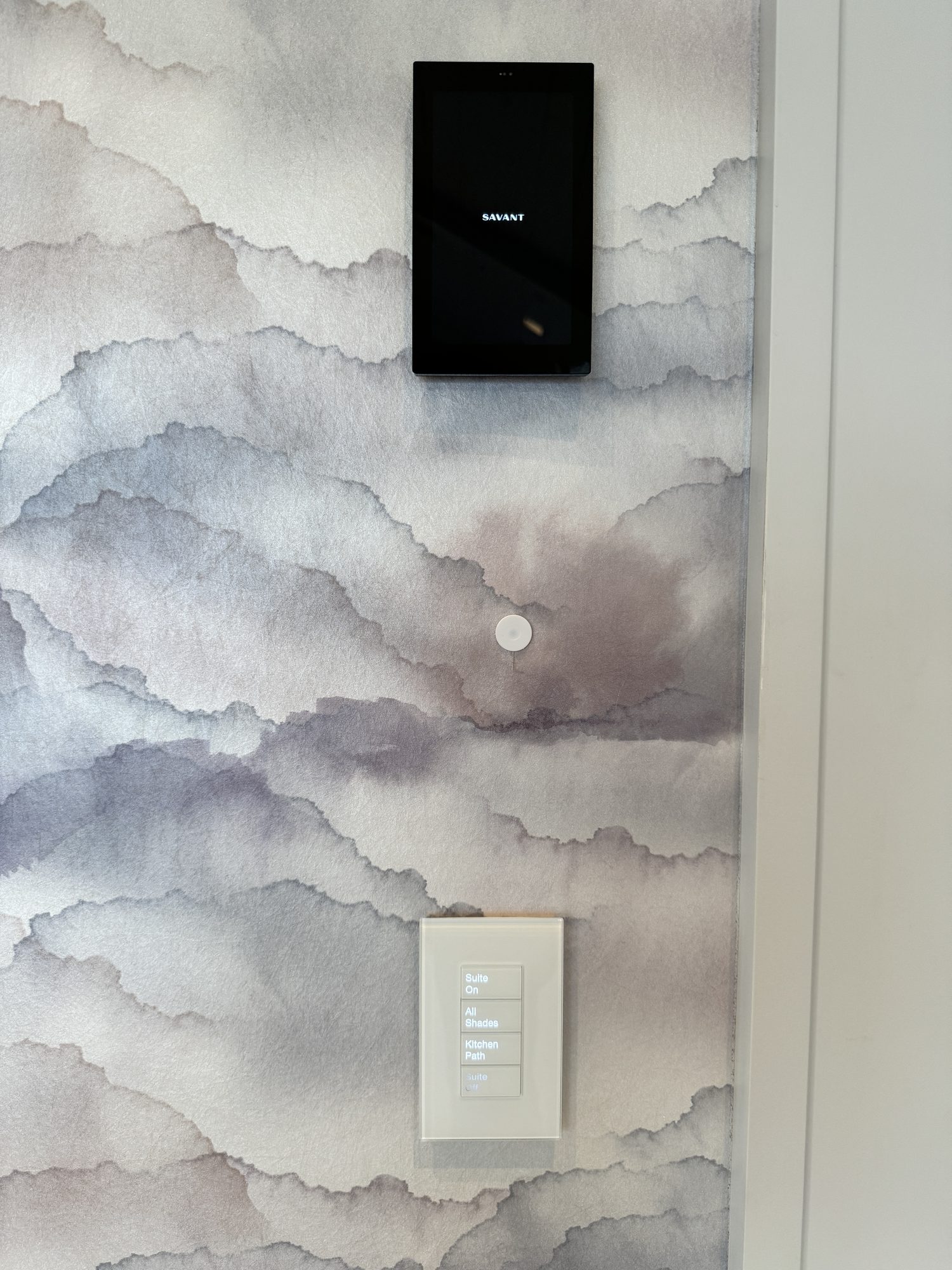 Keypad beside an in-wall touchscreen