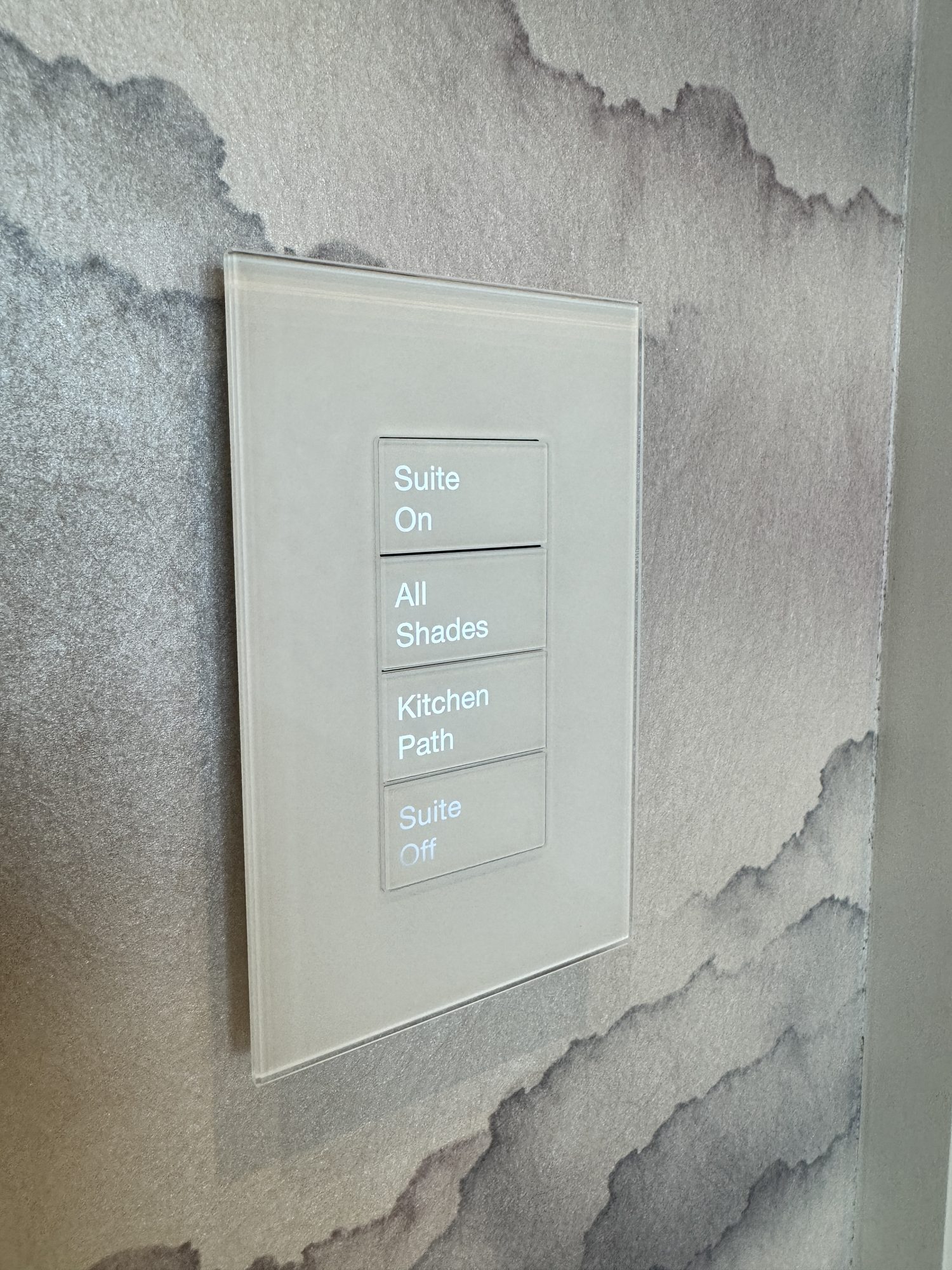 White Palladiom keypad on patterned wallpaper