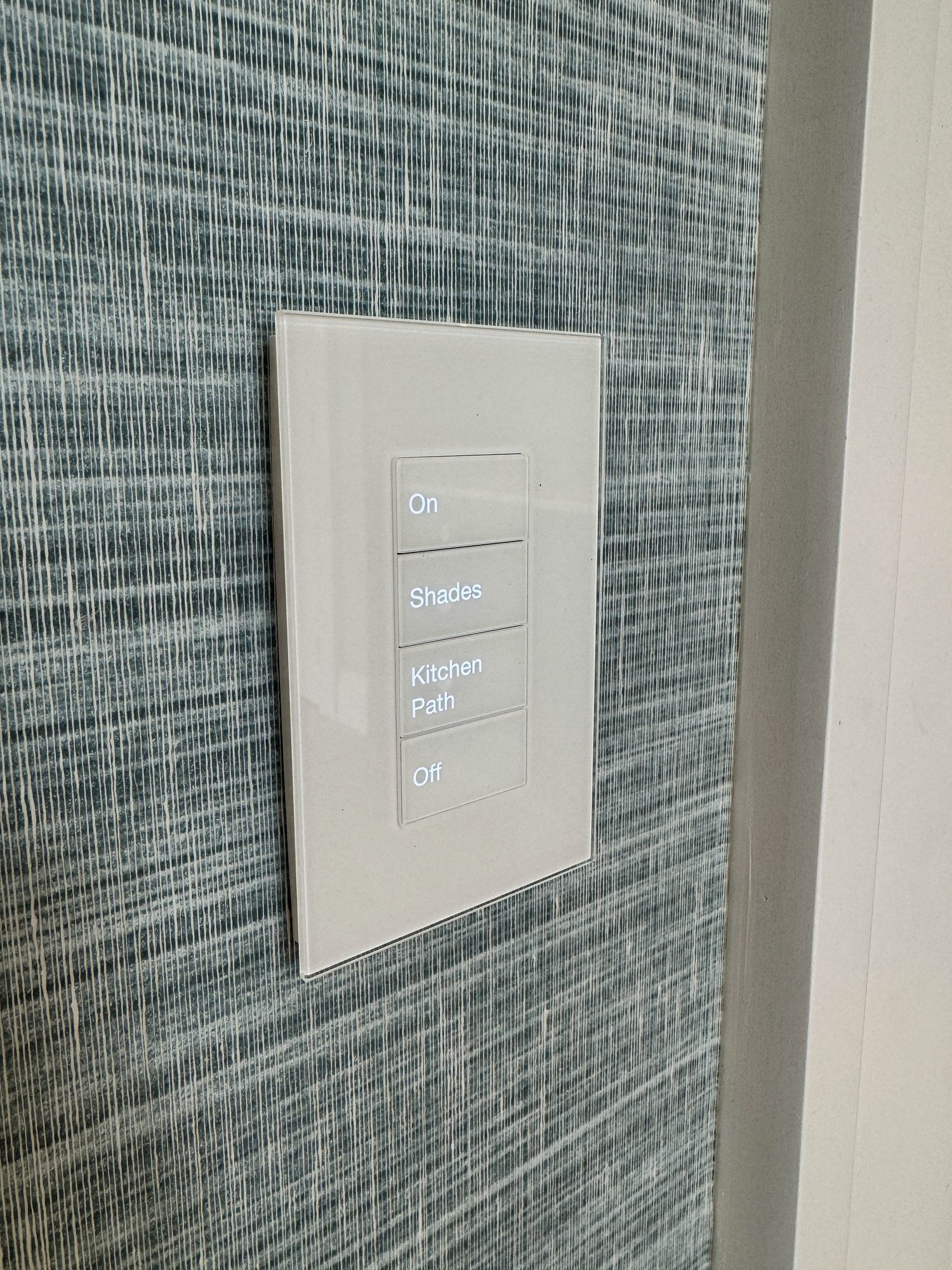 White Palladiom keypad on grasscloth