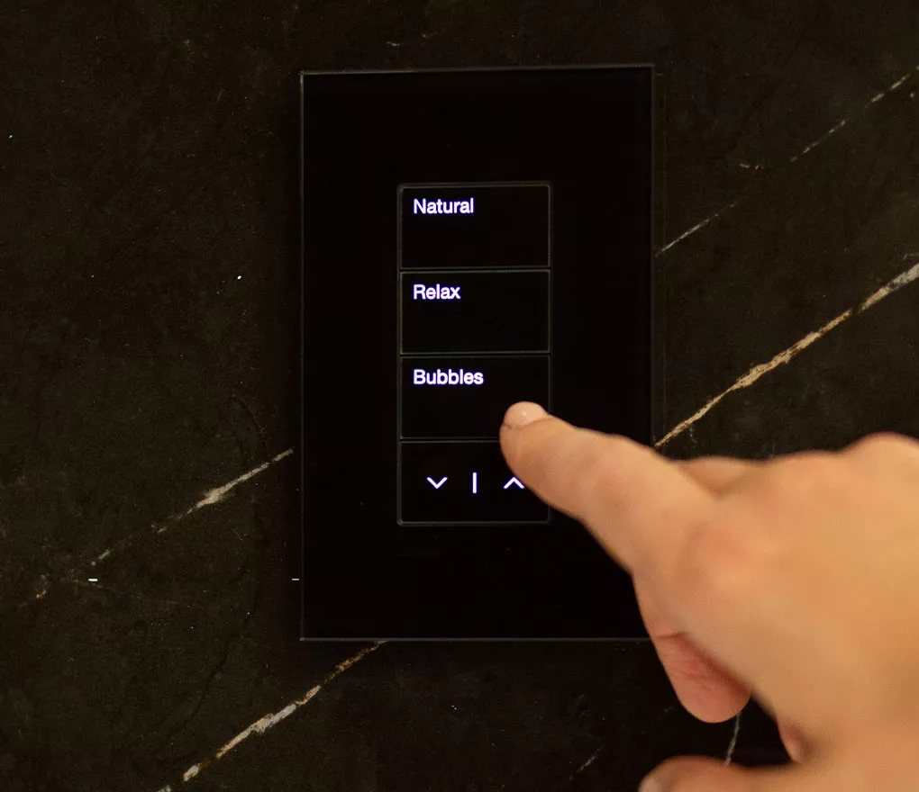 Control surface on a black marble wall